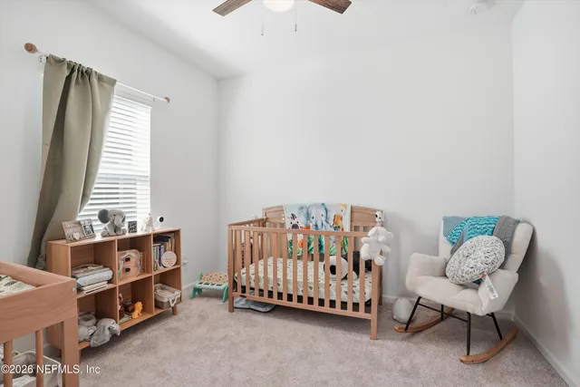 a bed room with furniture and a window