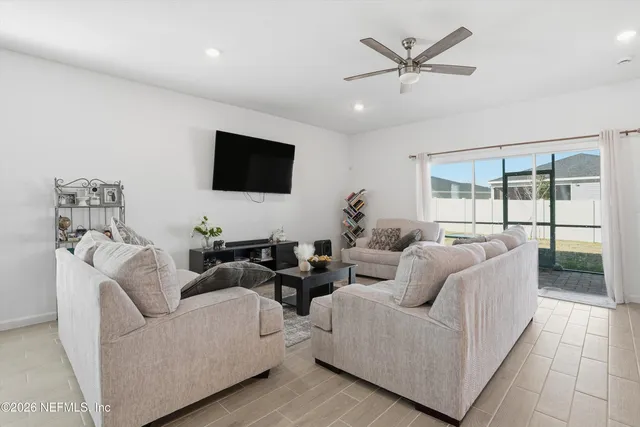 a living room with furniture and a flat screen tv