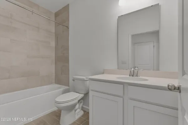 a view of yellow house with a outdoor space