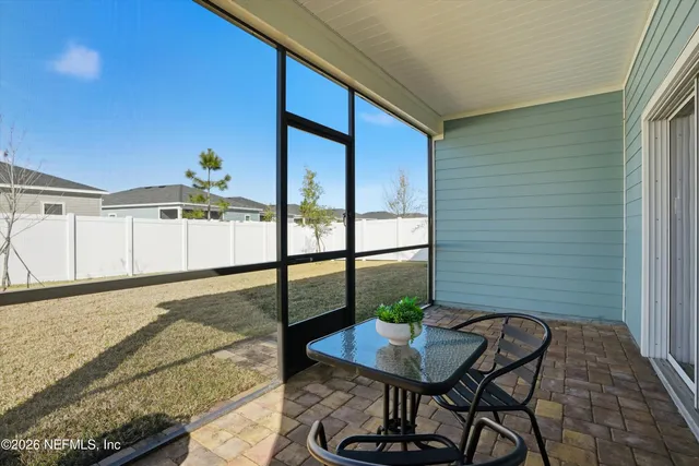 a view of a balcony with furniture