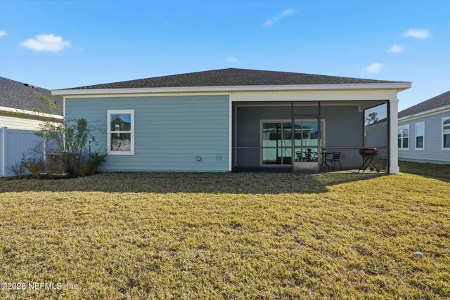 a view of yellow house with a outdoor space