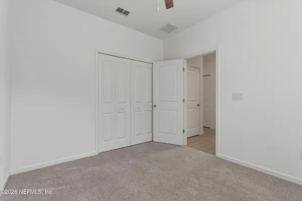 a view of swimming pool with sitting area