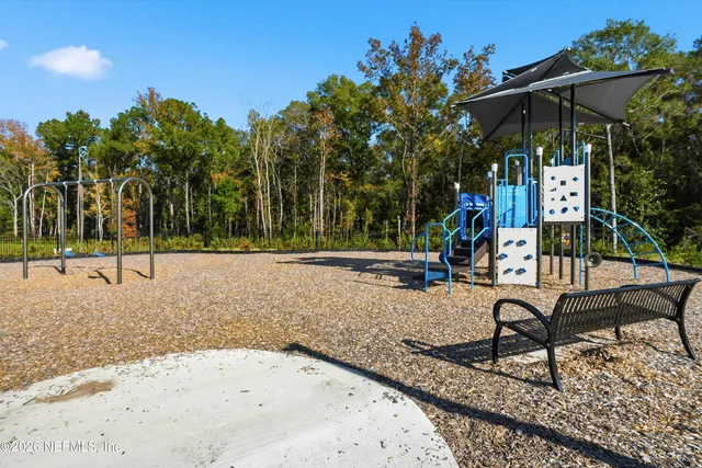 swimming pool view with a seating space