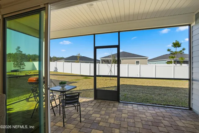 a view of a swimming pool and outdoor seating