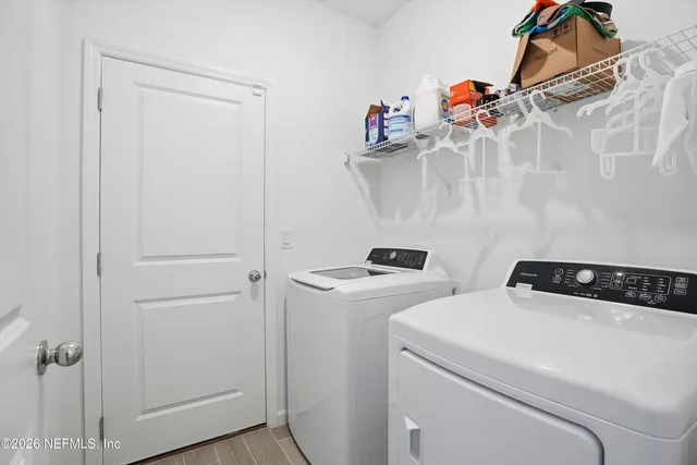a utility room with dryer and washer