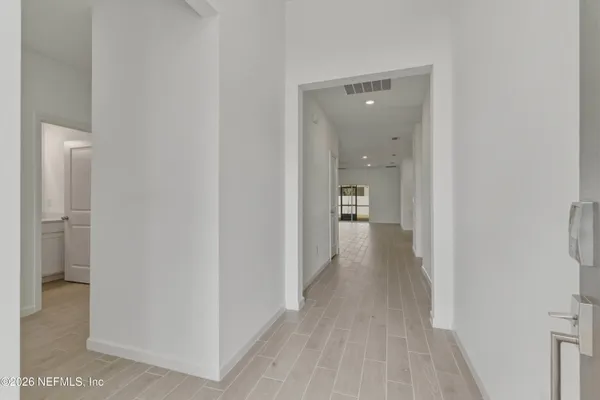 a kitchen with kitchen island a sink stainless steel appliances and cabinets