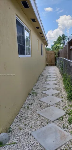 a view of backyard and entertaining space