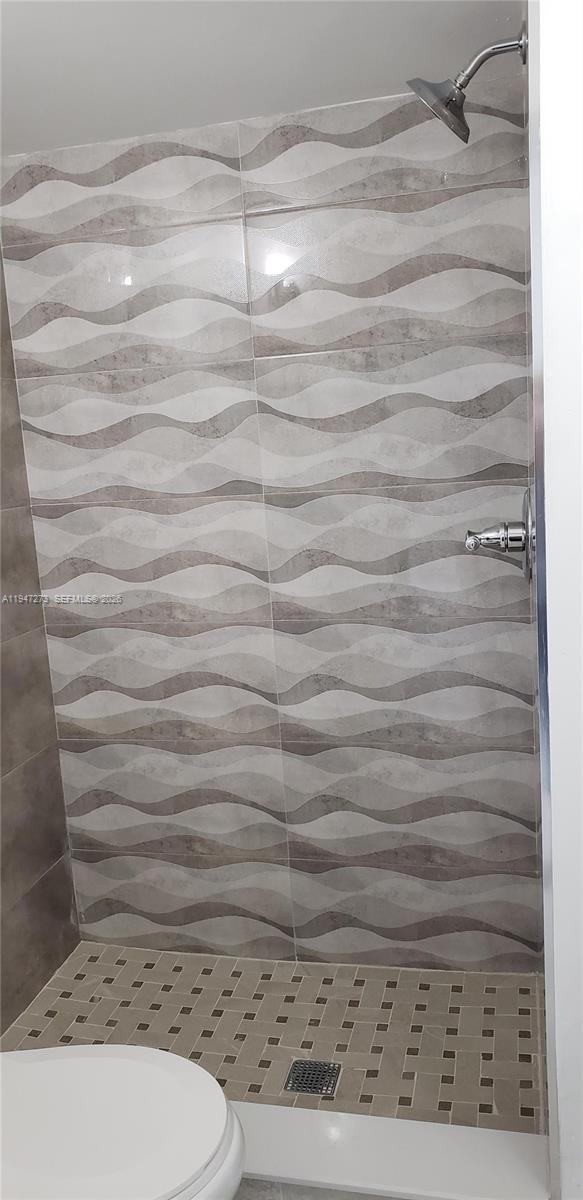9285 Southwest 37th Street Miami, FL 33165 - Photo 10 of 17 a bathroom with a toilet and a shower