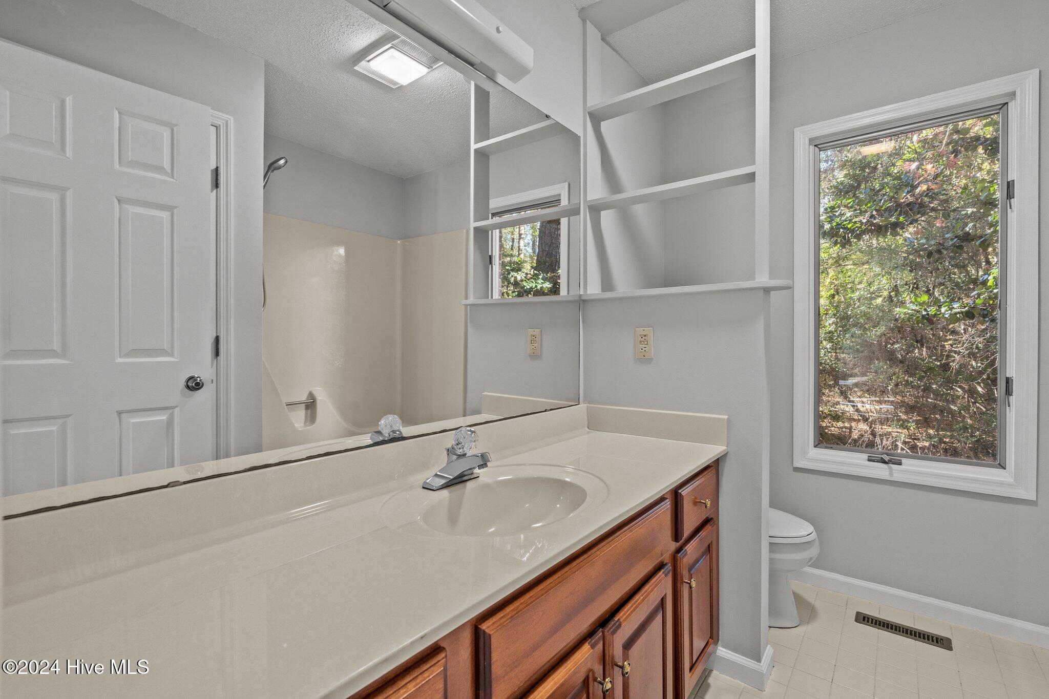 560 South Bethesda Road Southern Pines, NC 28387 - Photo 39 of 53 Bathroom for both bedrooms on left side of home.