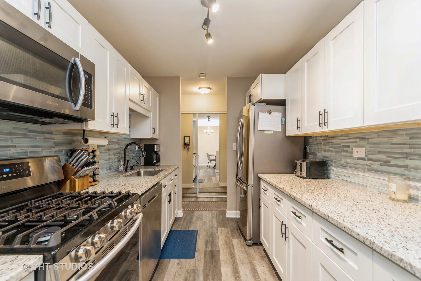 516 North Wilke Road, Unit 106 Palatine, IL 60074 - Photo 12 of 20 a kitchen with stainless steel appliances a stove a sink a refrigerator and cabinets