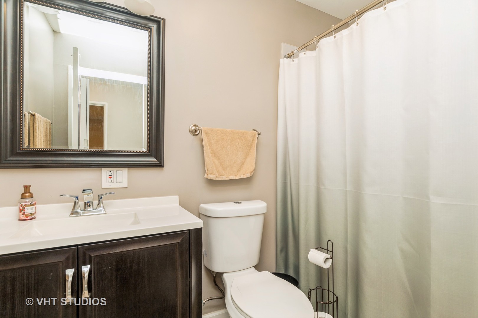 516 North Wilke Road, Unit 106 Palatine, IL 60074 - Photo 17 of 20 a bathroom with a sink a toilet and a mirror