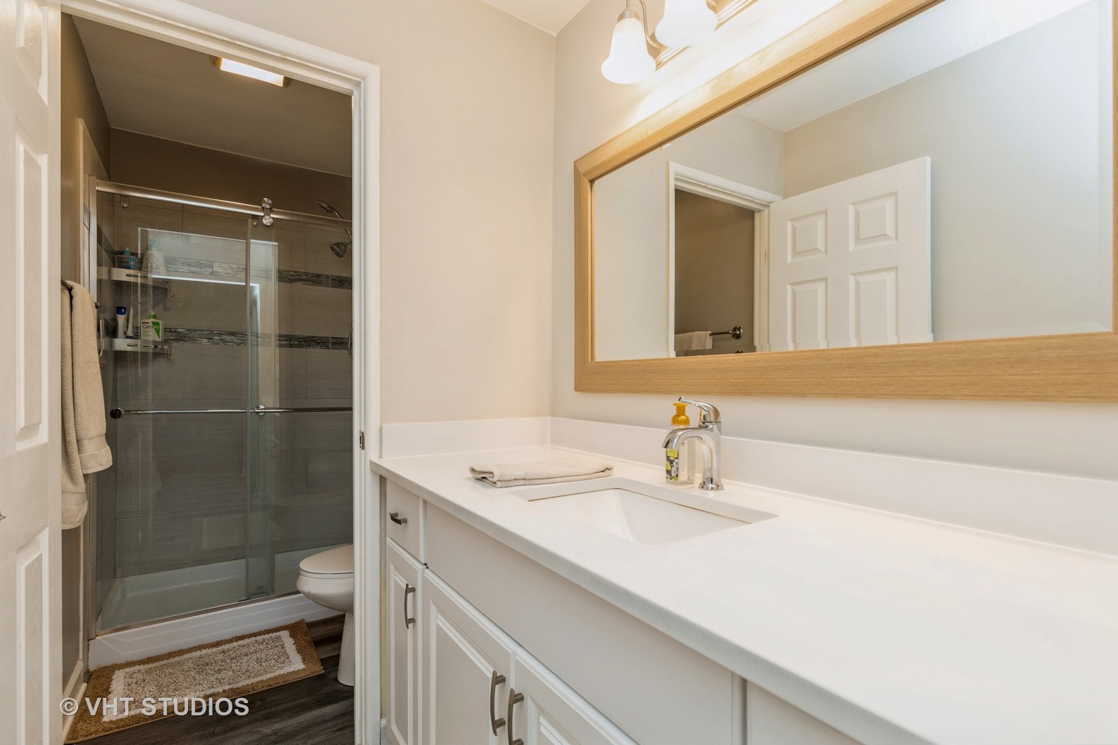 516 North Wilke Road, Unit 106 Palatine, IL 60074 - Photo 20 of 20 a bathroom with a sink a toilet and shower