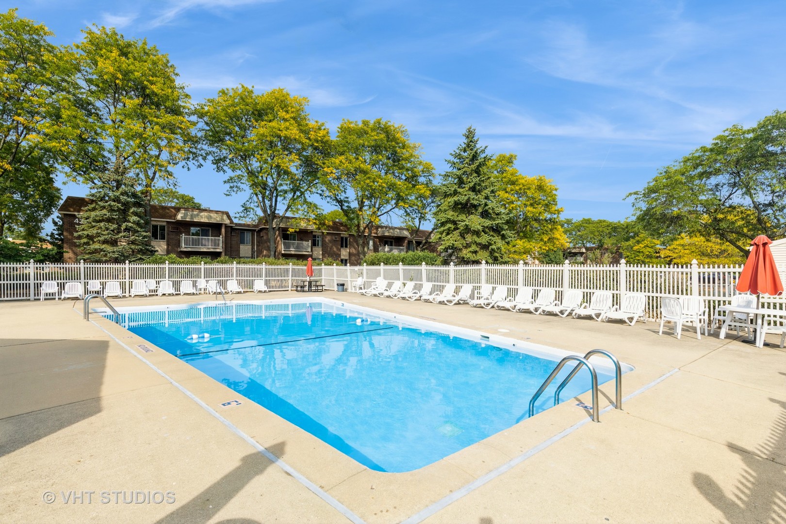 516 North Wilke Road, Unit 106 Palatine, IL 60074 - Photo 3 of 20 a view of a swimming pool with an outdoor seating