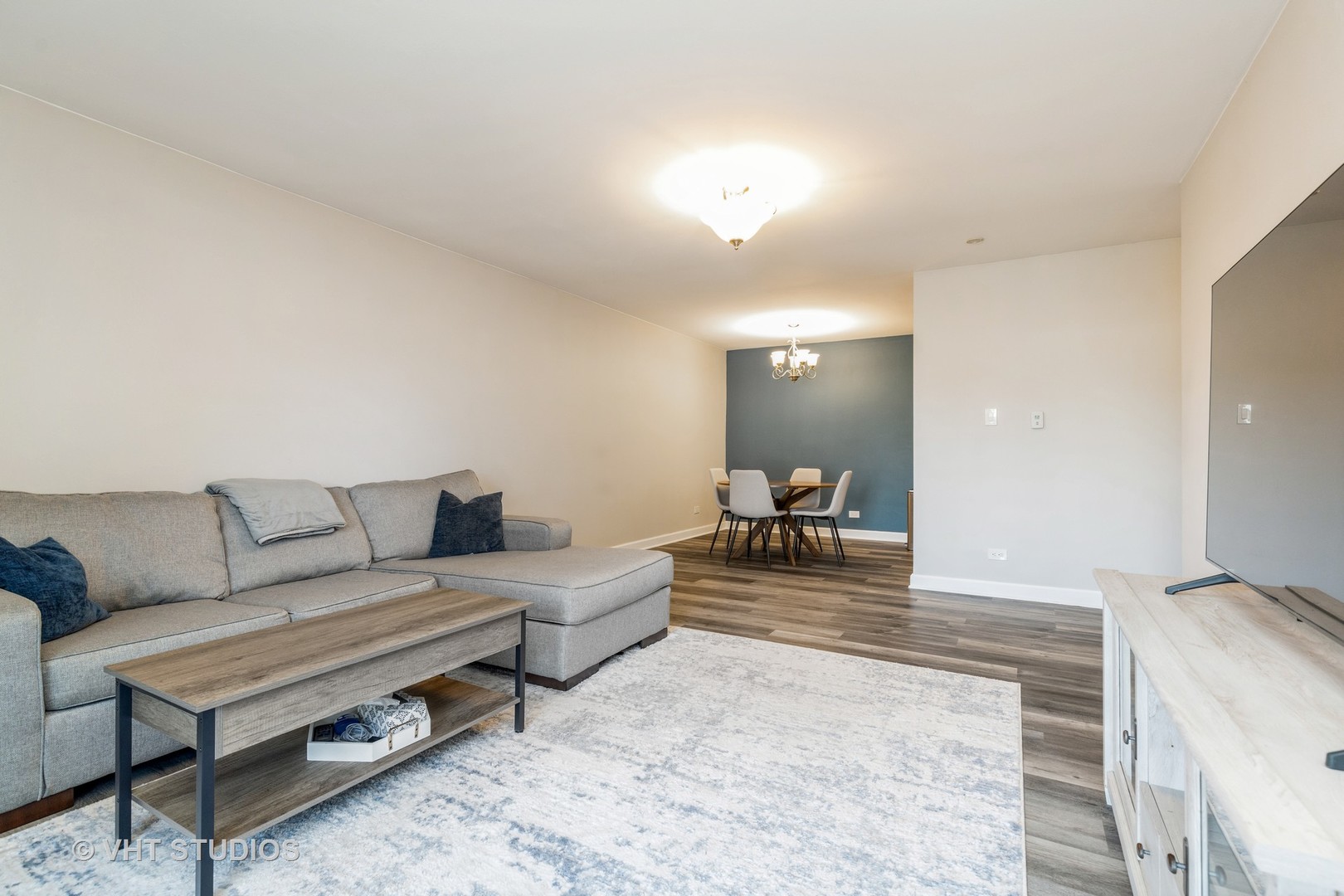 516 North Wilke Road, Unit 106 Palatine, IL 60074 - Photo 8 of 20 a living room with furniture and a couch