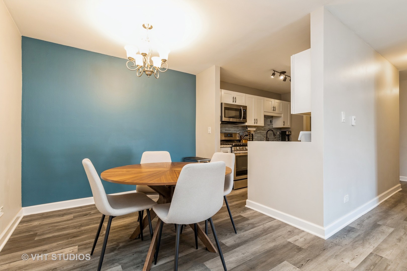 516 North Wilke Road, Unit 106 Palatine, IL 60074 - Photo 10 of 20 a dining room with furniture and wooden floor