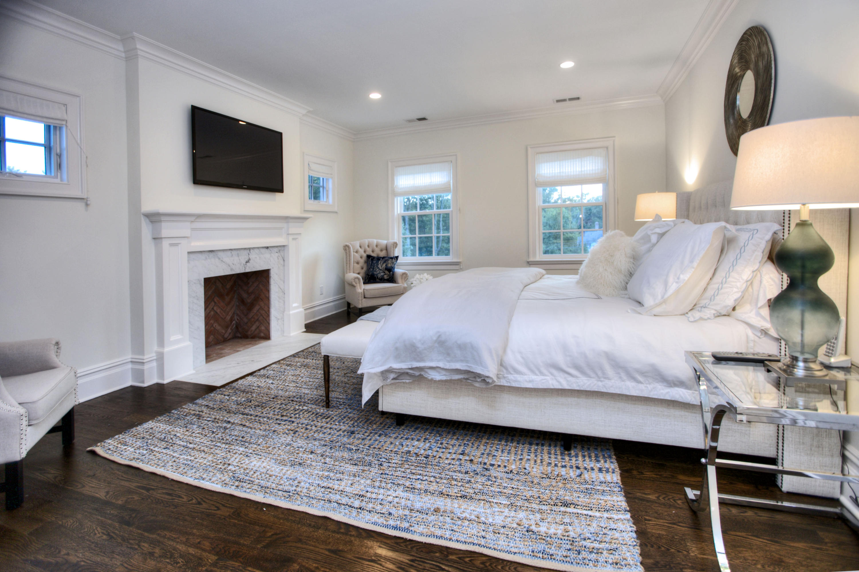 304 Brookside Road Darien, CT 06820 - Photo 13 of 25 a bedroom with a bed and a fireplace
