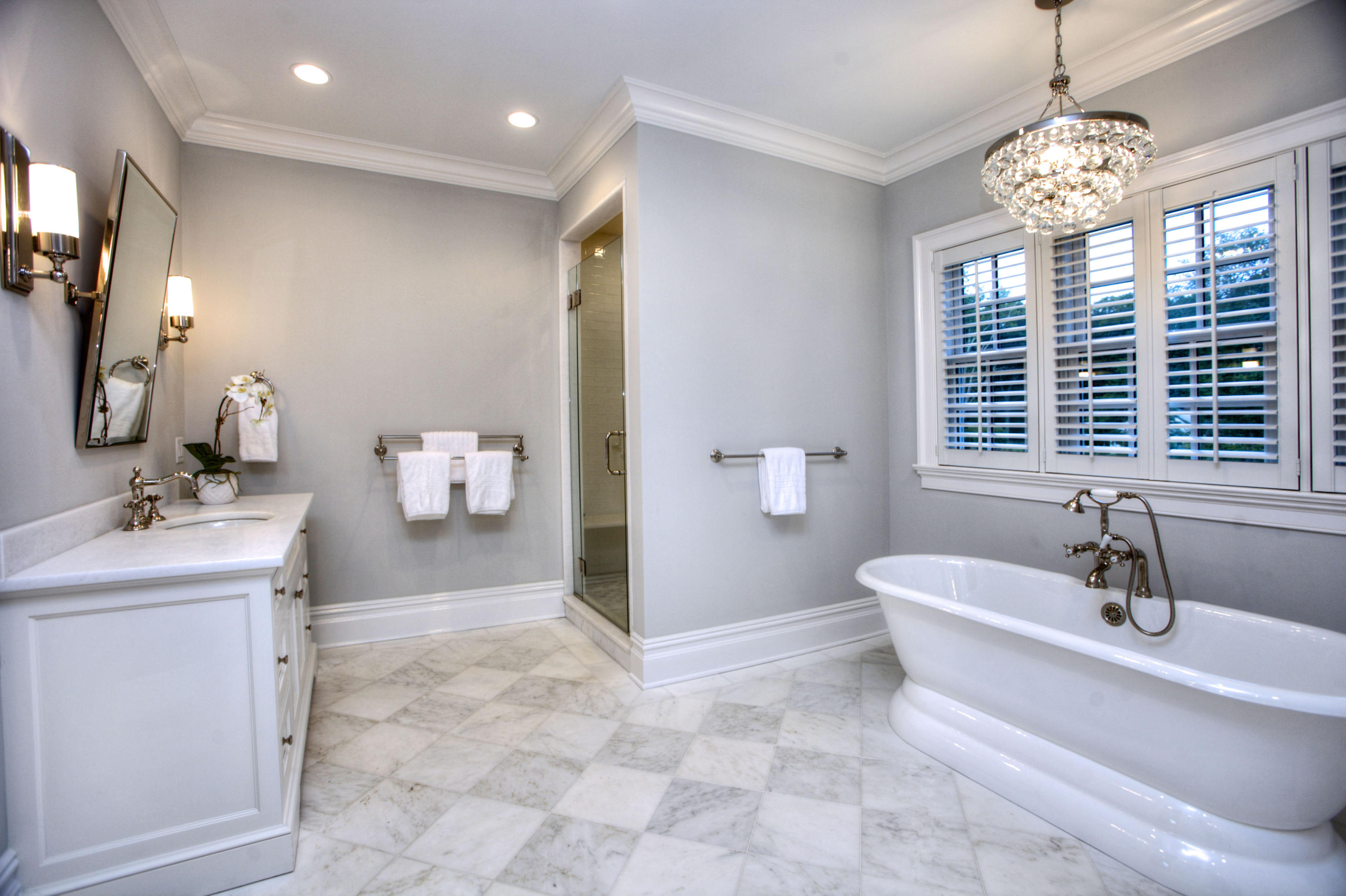 304 Brookside Road Darien, CT 06820 - Photo 14 of 25 a spacious bathroom with a sink a large mirror and a bathtub
