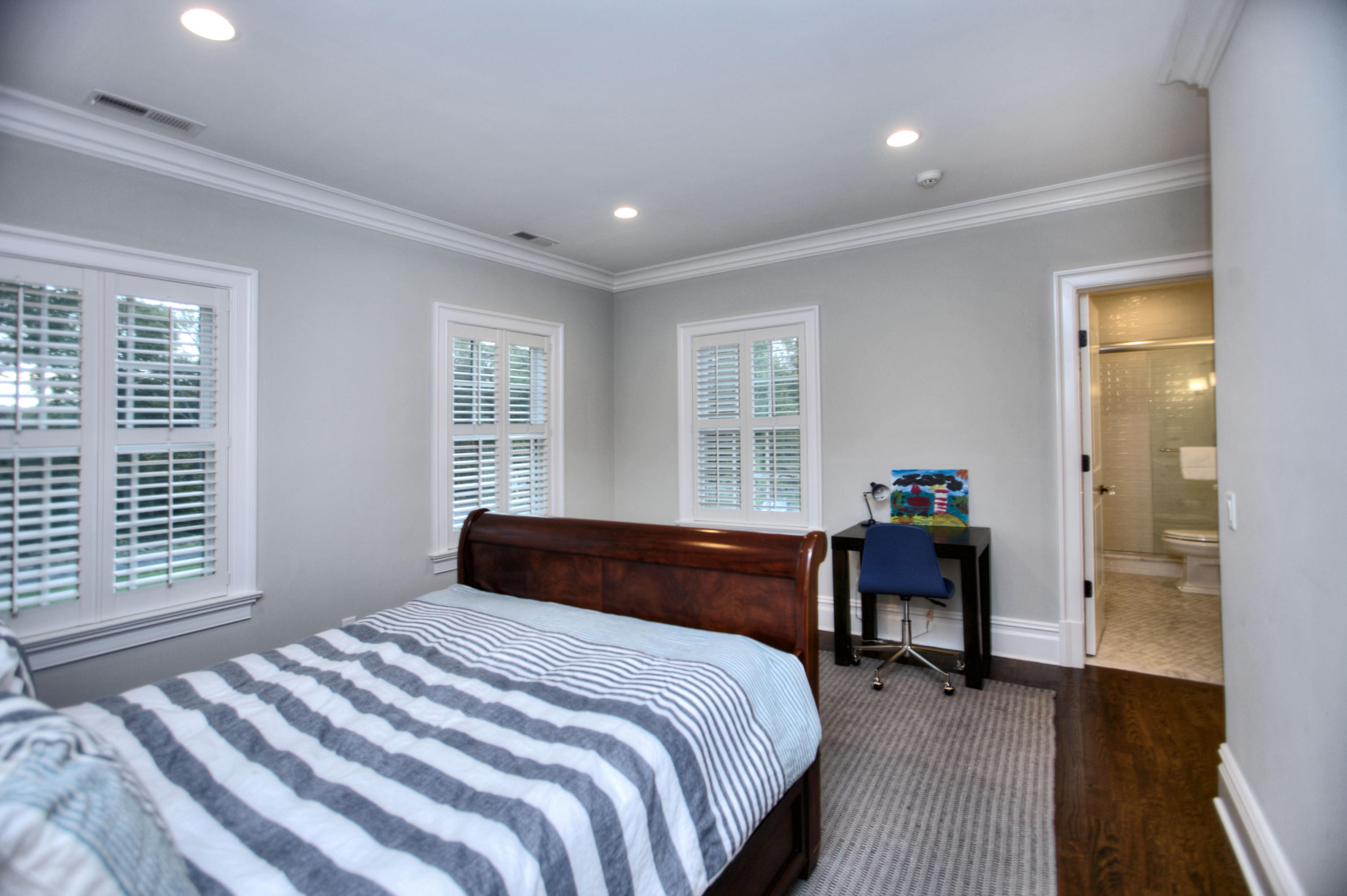 304 Brookside Road Darien, CT 06820 - Photo 18 of 25 a bedroom with a bed and a large window