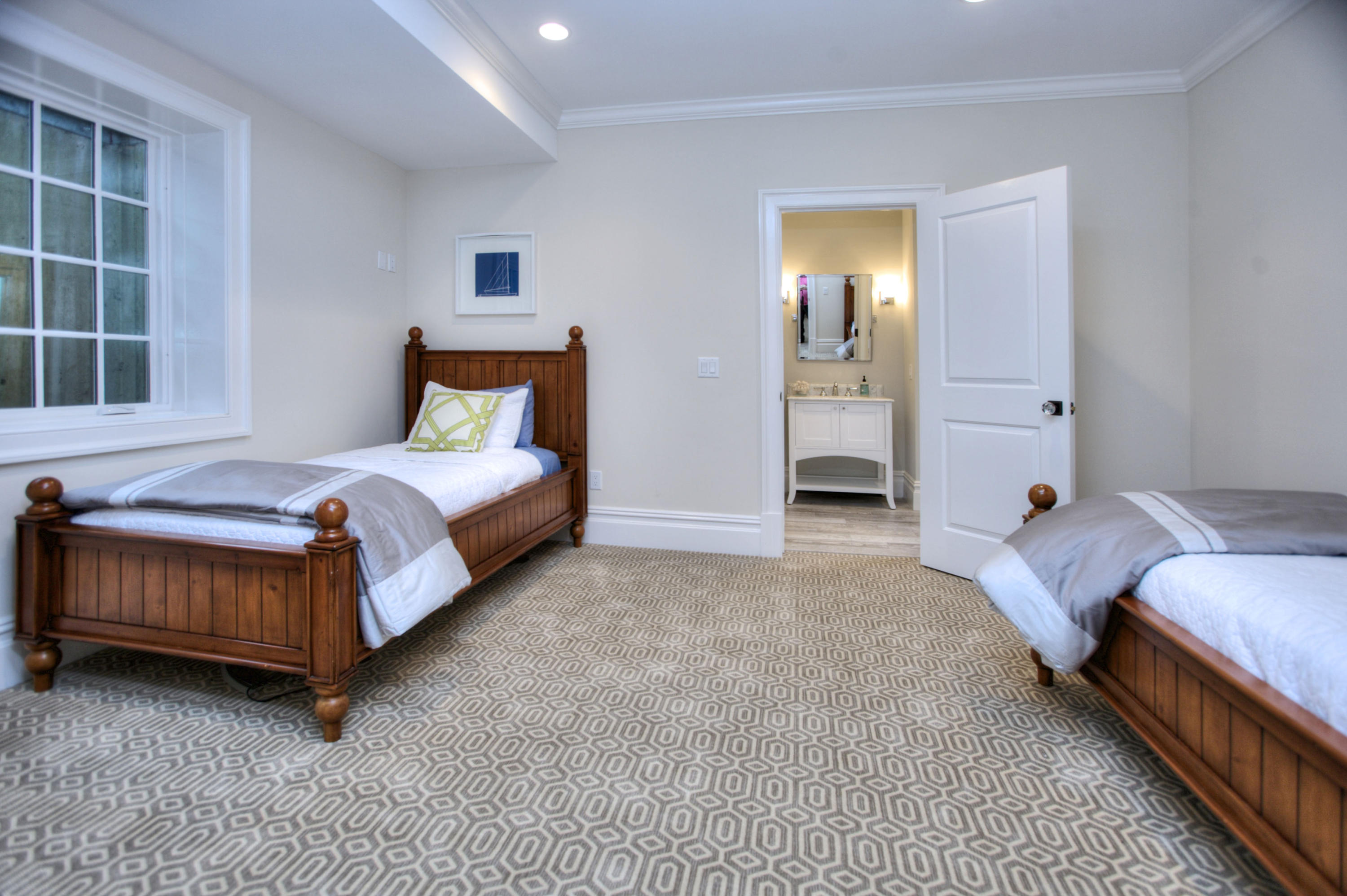 304 Brookside Road Darien, CT 06820 - Photo 22 of 25 a spacious bedroom with a bed and a window