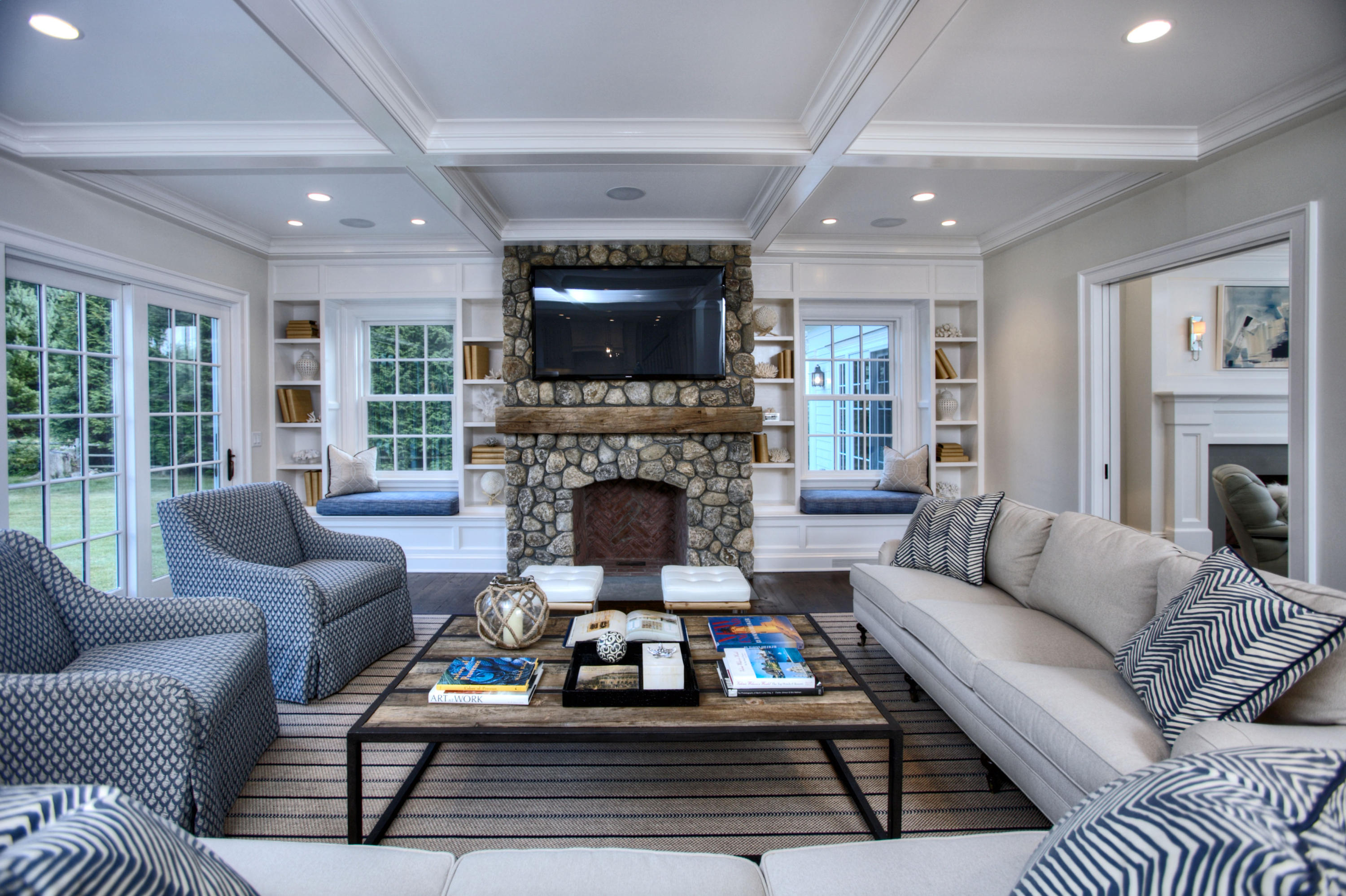 304 Brookside Road Darien, CT 06820 - Photo 9 of 25 a living room with furniture a flat screen tv and a fireplace