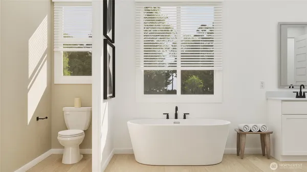 a white bath tub sitting next to a white toilet