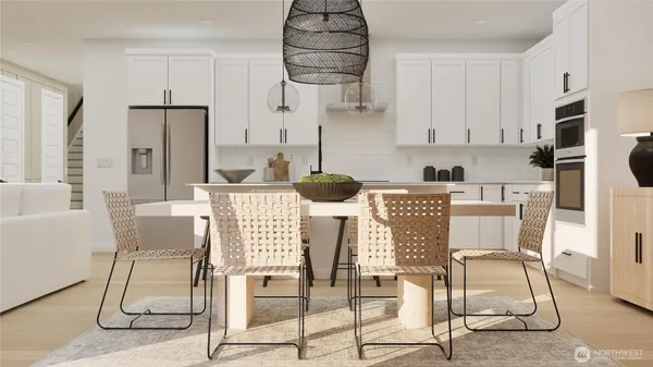 a kitchen with stainless steel appliances kitchen island granite countertop a table and chairs
