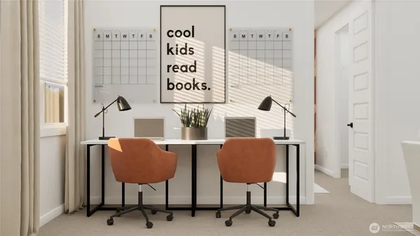 a workspace with furniture and a painting on the wall