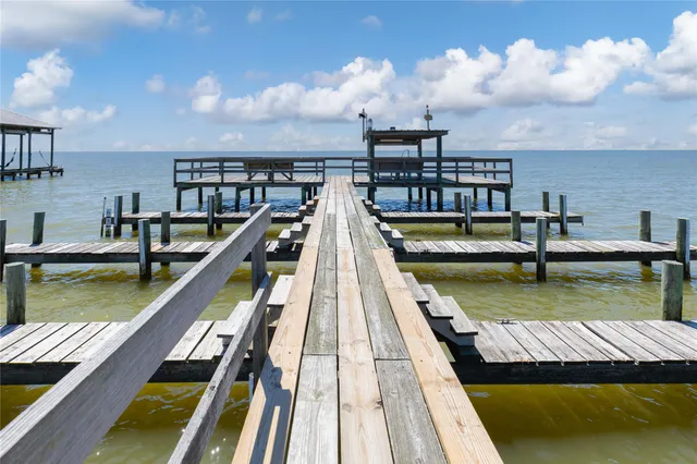 a view of a lake with houses in the back