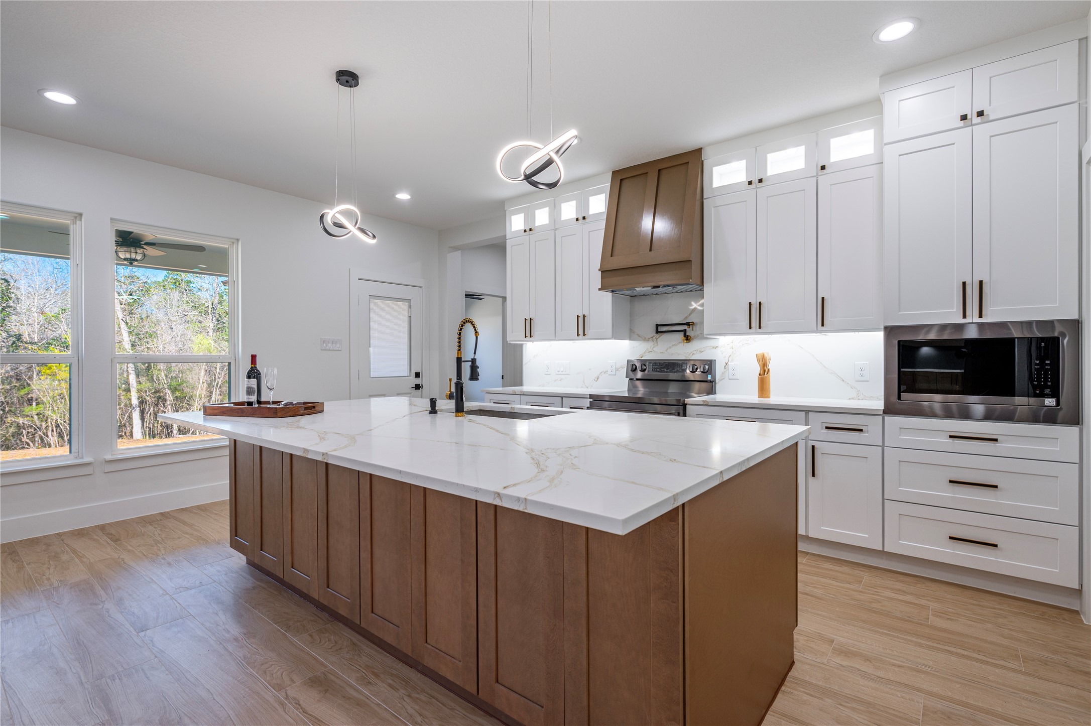 352 County Road 6490 Dayton, TX 77535 - Photo 16 of 45 a kitchen with sink stove and refrigerator