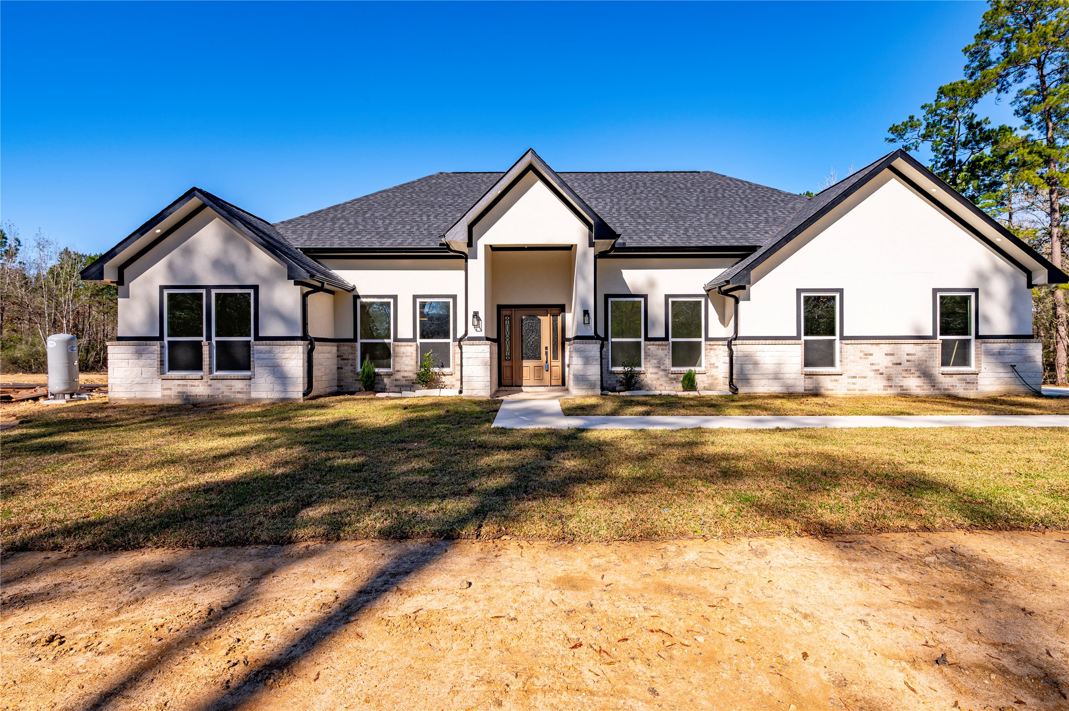 352 County Road 6490 Dayton, TX 77535 - Photo 3 of 45 a view of a house with pool and sitting area