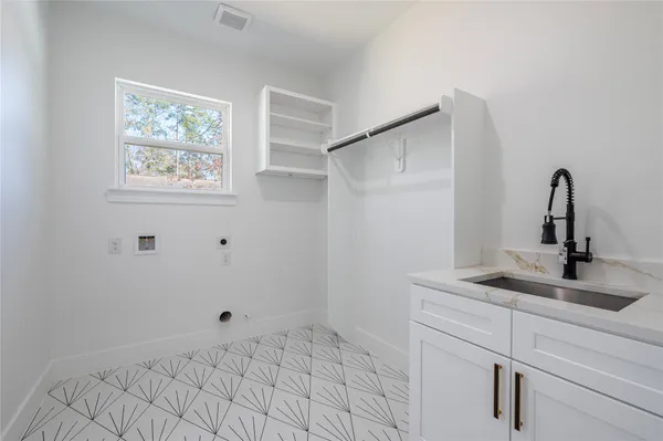 a bathroom with a sink and vanity