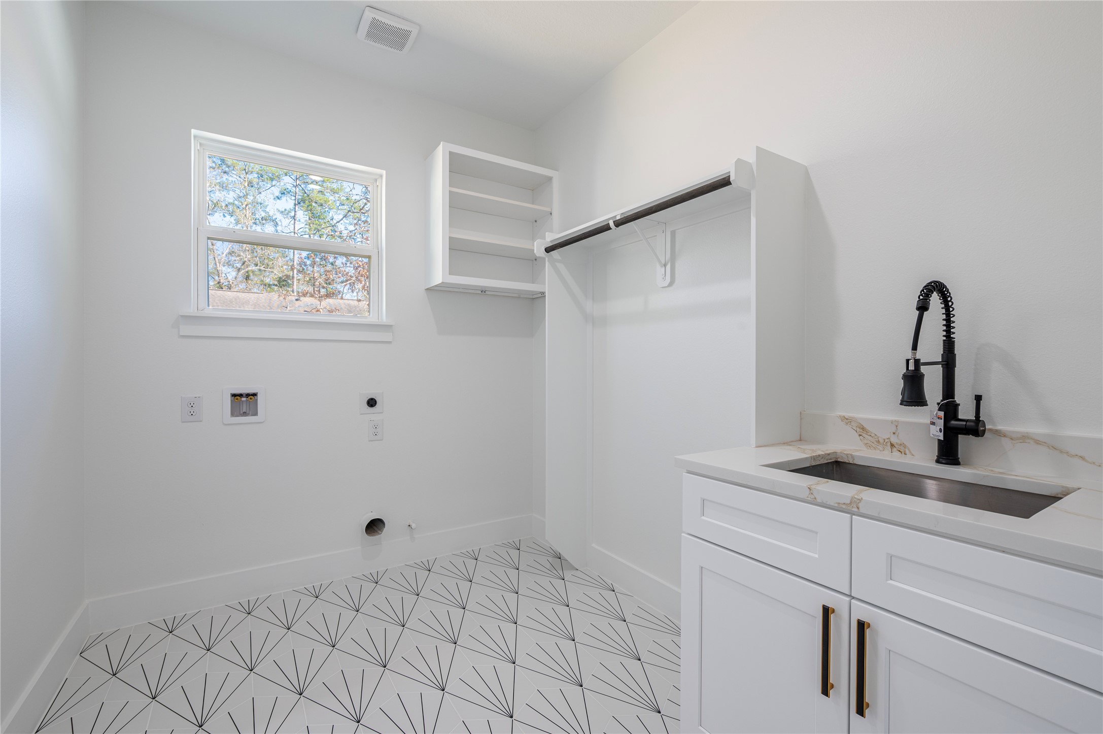352 County Road 6490 Dayton, TX 77535 - Photo 37 of 45 a bathroom with a sink and vanity