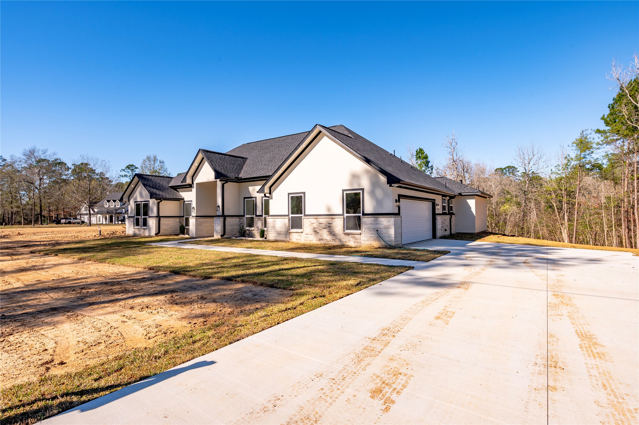 352 County Road 6490 Dayton, TX 77535 - Photo 5 of 45 a view of a house with snow on the road