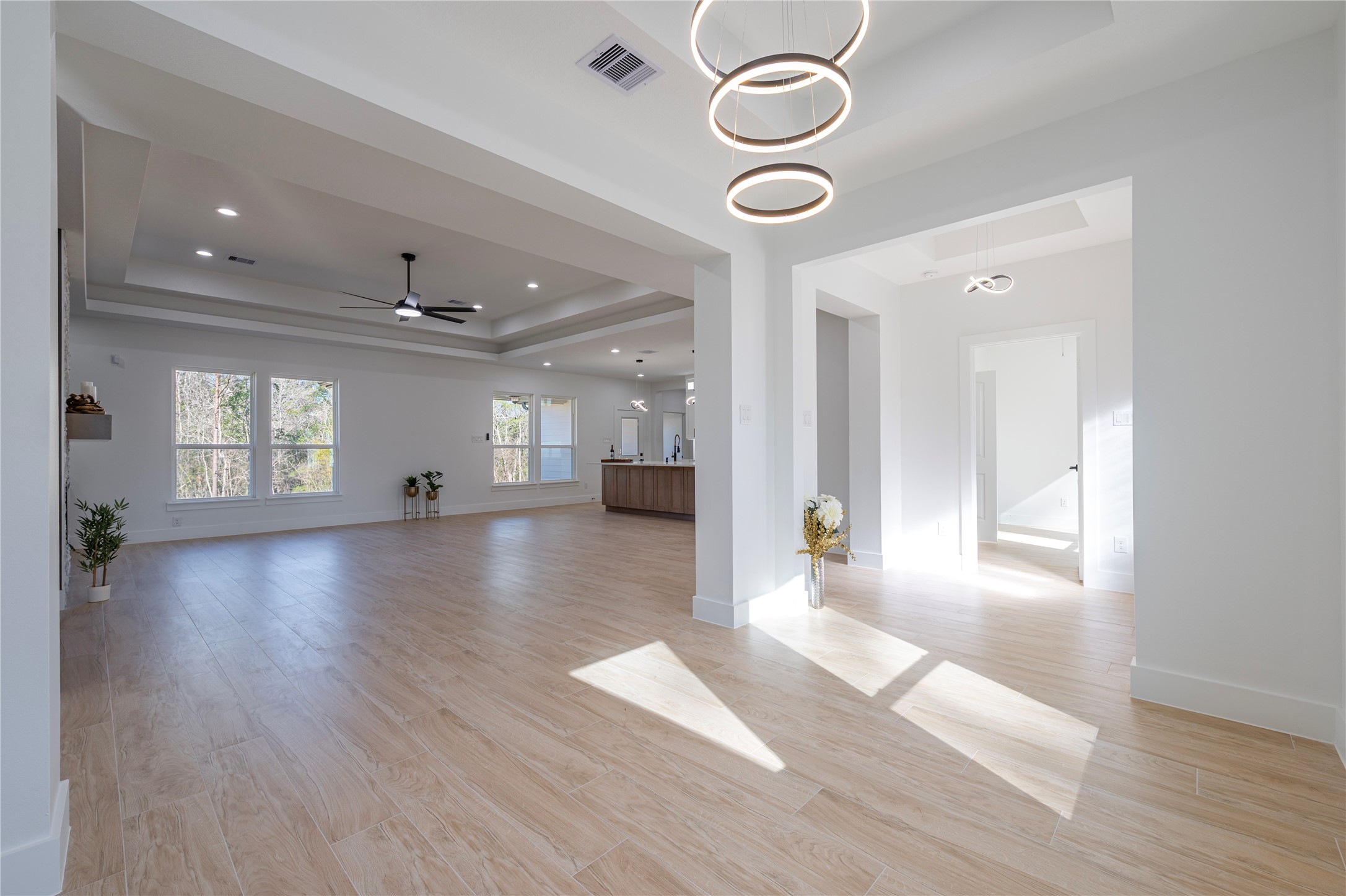 352 County Road 6490 Dayton, TX 77535 - Photo 10 of 45 an empty room with wooden floor and windows