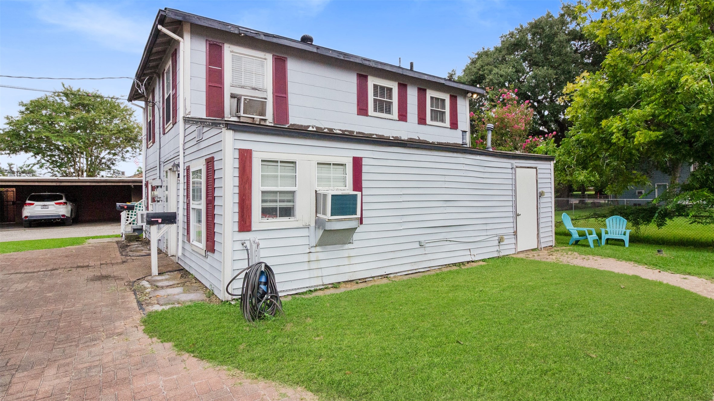 317 West Lewis Street Conroe, TX 77301 - Photo 11 of 30 a front view of a house with garden