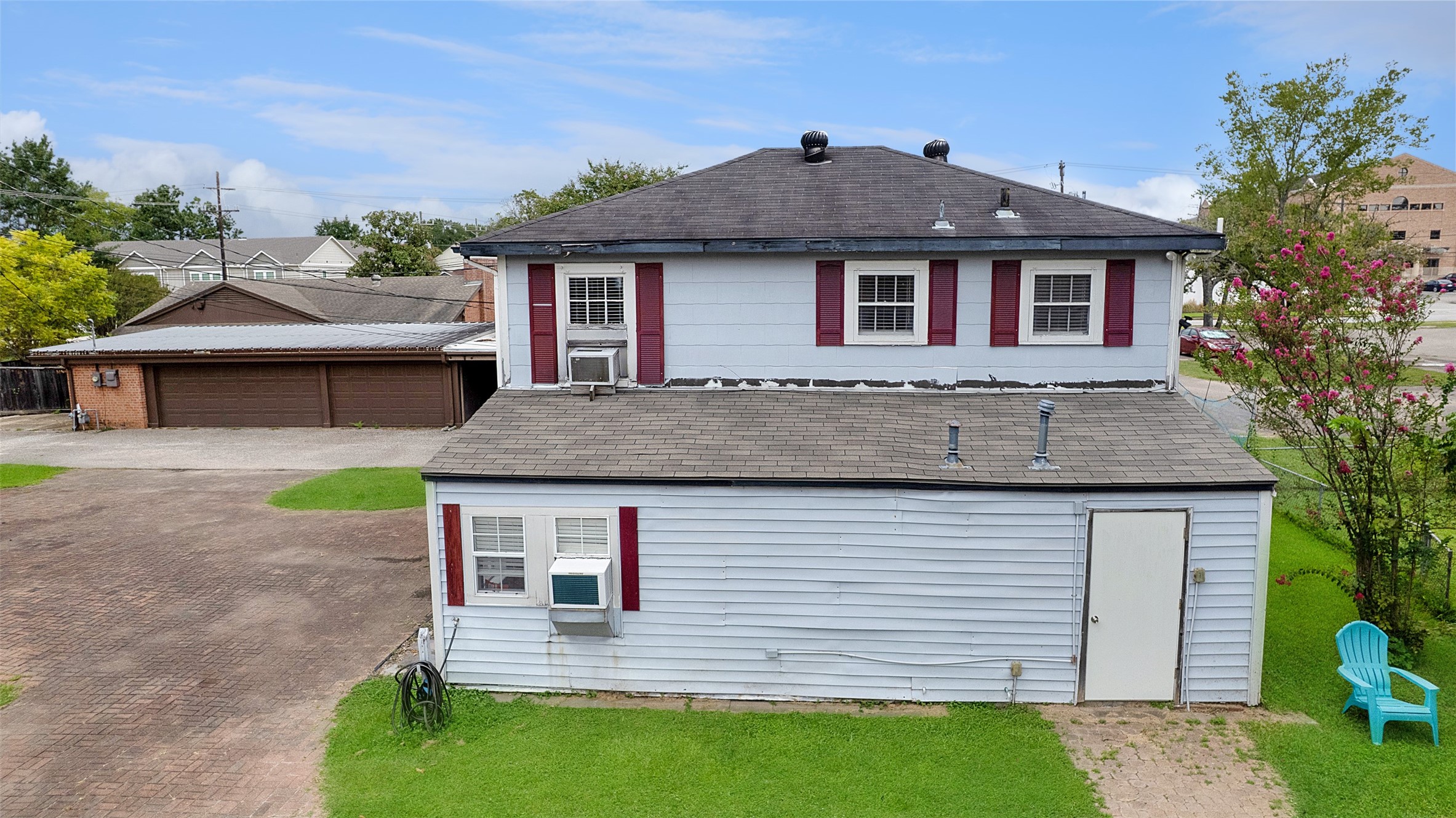 317 West Lewis Street Conroe, TX 77301 - Photo 13 of 30 a front view of a house with garden