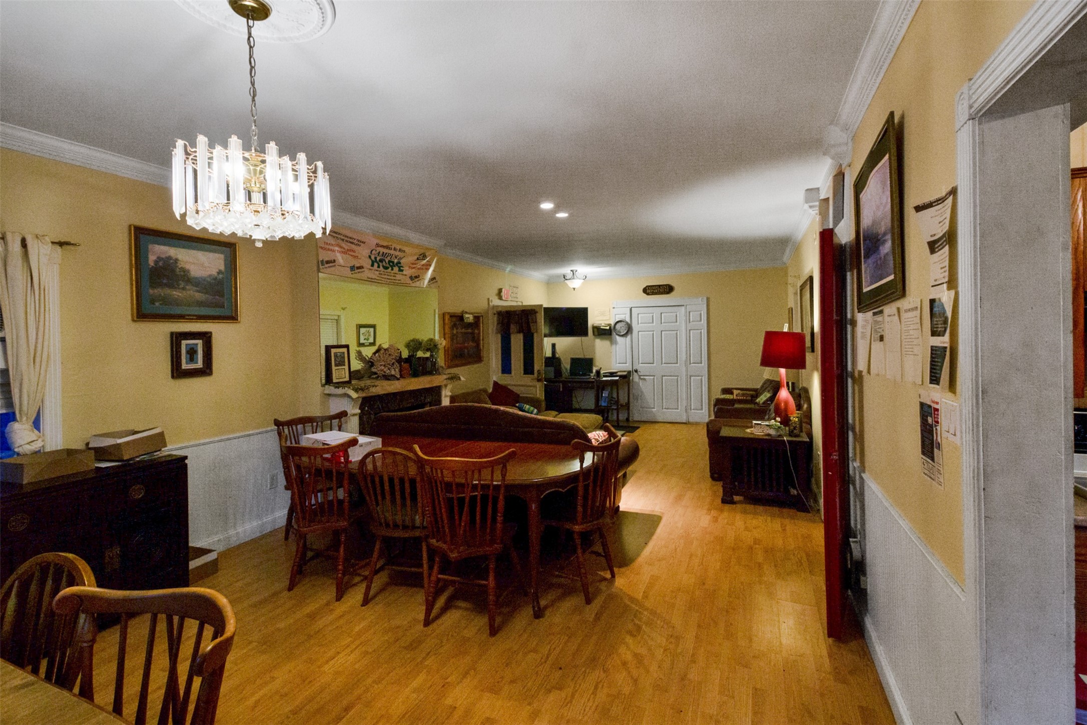 317 West Lewis Street Conroe, TX 77301 - Photo 18 of 30 a view of a dining room with furniture and wooden floor