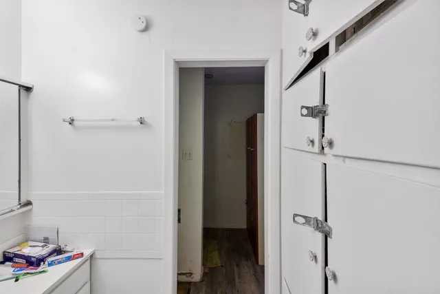 a kitchen with a stove and a refrigerator