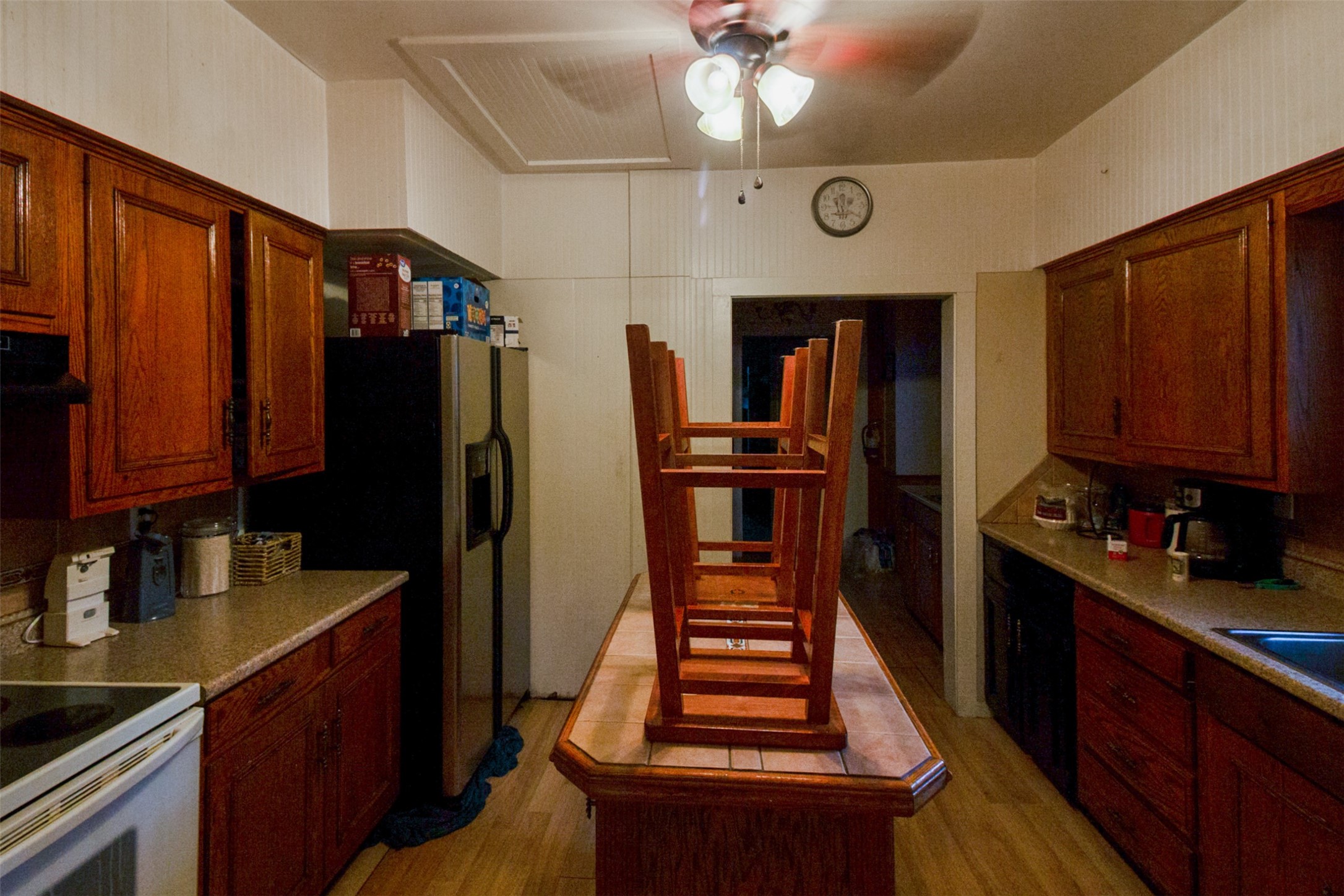 317 West Lewis Street Conroe, TX 77301 - Photo 27 of 30 a kitchen with stainless steel appliances kitchen island granite countertop a refrigerator stove and sink