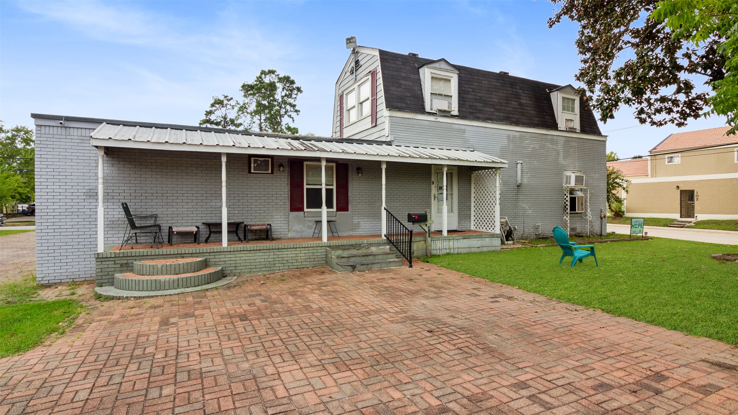 317 West Lewis Street Conroe, TX 77301 - Photo 7 of 30 a front view of a house with garden