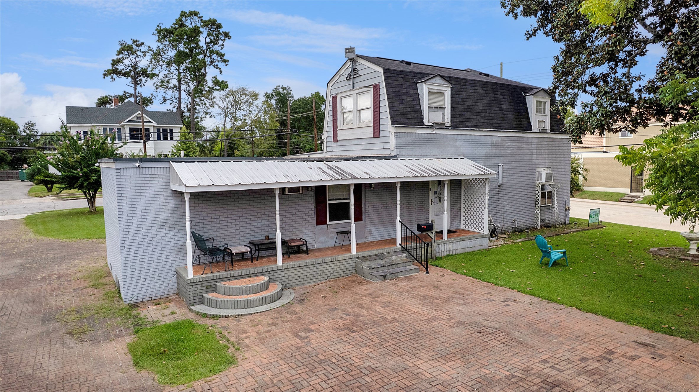 317 West Lewis Street Conroe, TX 77301 - Photo 10 of 30 a front view of a house with garden and trees