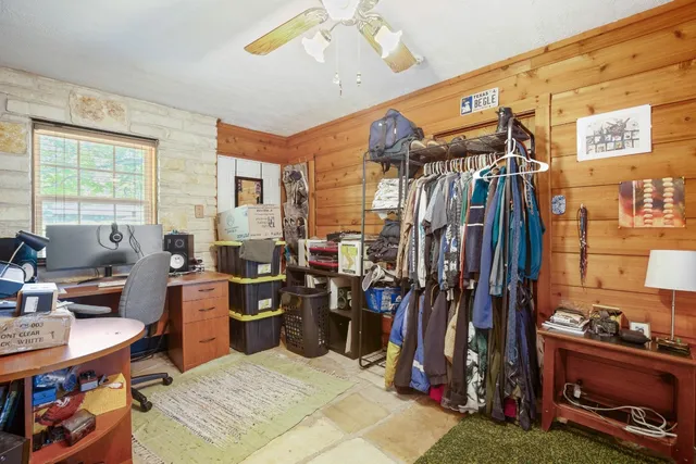 a living room with lots of furniture and gym equipment