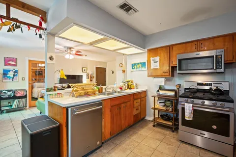 a kitchen with a stove and a microwave