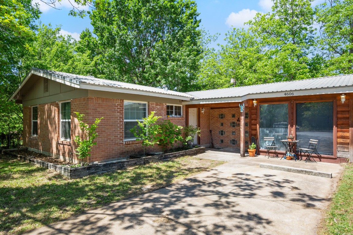 4606 South 2nd Street Austin, TX 78745 - Photo 2 of 24 a view of a house with backyard outdoor seating area and garden