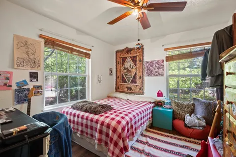 a bedroom with a bed and a window