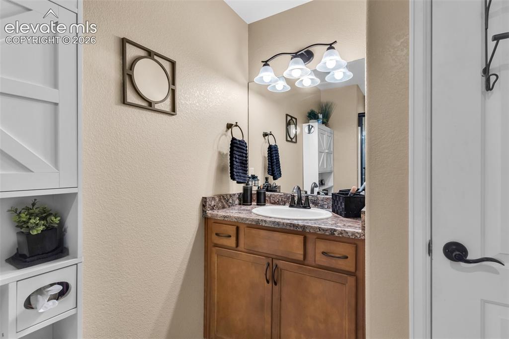 415 Empire Road Canon City, CO 81212 - Photo 32 of 40 a bathroom with a sink and a mirror
