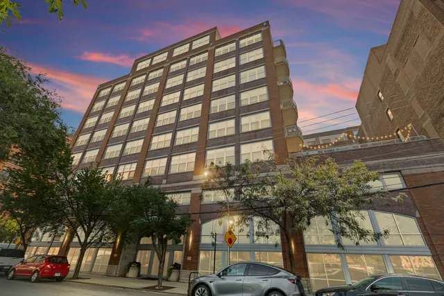 a view of a building and car parked
