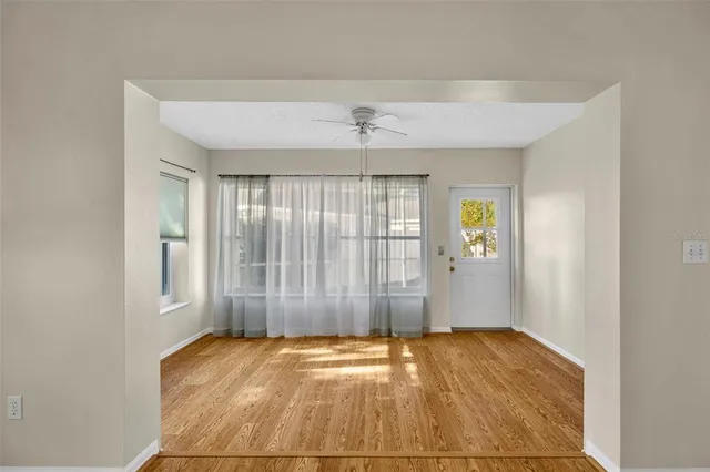 a view of a backyard with garden and patio