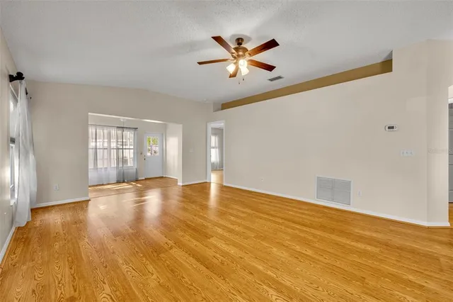 a kitchen with cabinets stainless steel appliances and sink