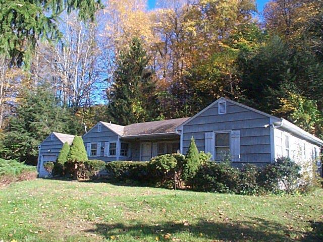 8 Old Mill Road New Milford, CT 06776 - Photo 1 of 1 a front view of a house with a yard